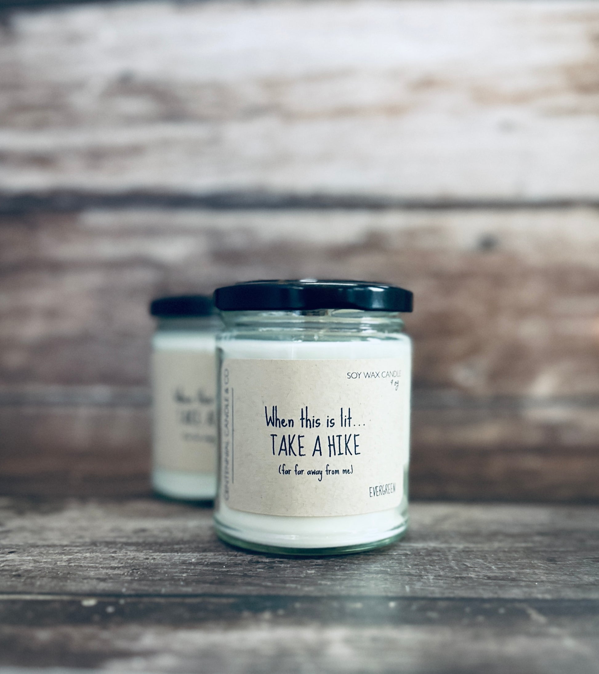 a couple of jars sitting on top of a wooden table